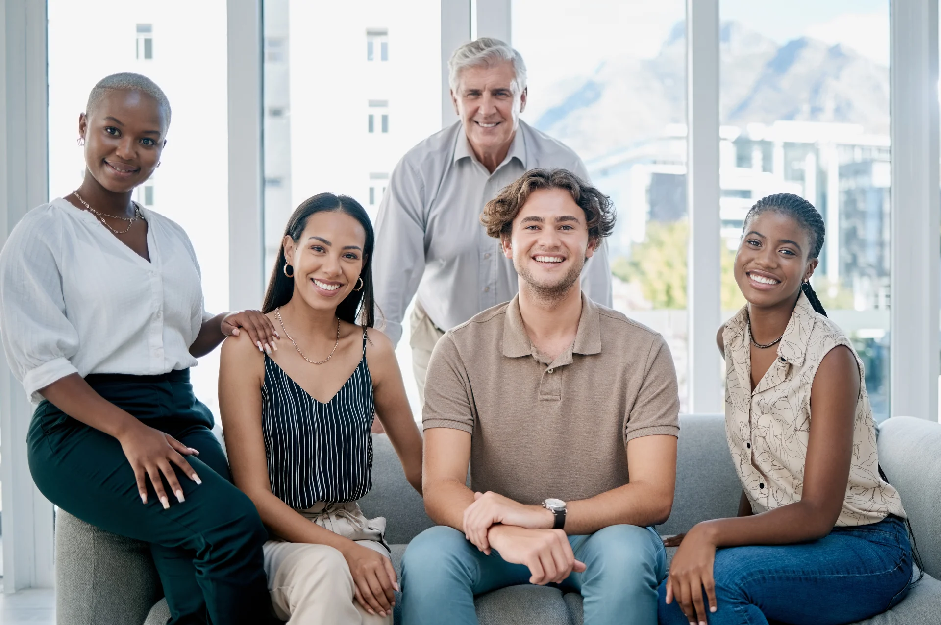 Business people, sofa and diversity portrait for vision, solidarity or team building in marketing o